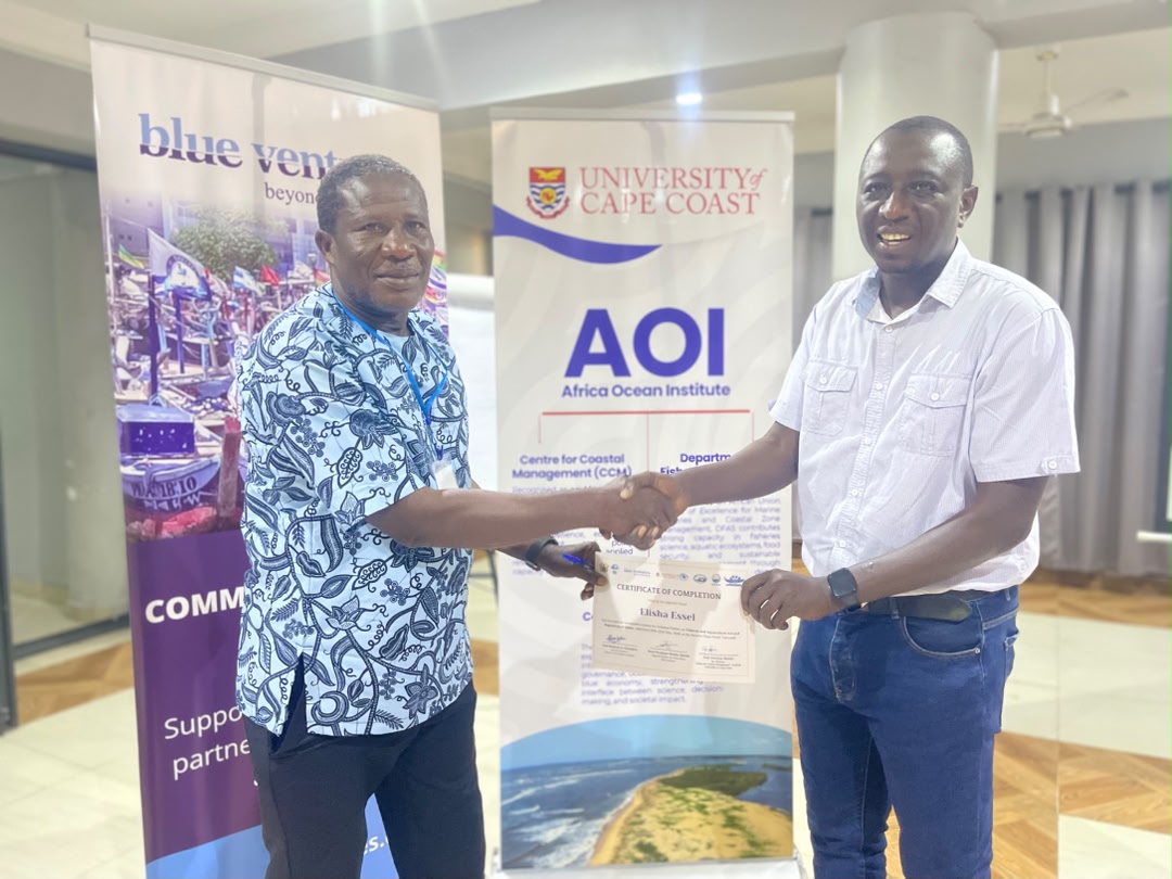 Fisherfolk trained on Ghana's New Fisheries and Aquaculture Act (Dr. Isaac Okyere handing out certificates to a participant)